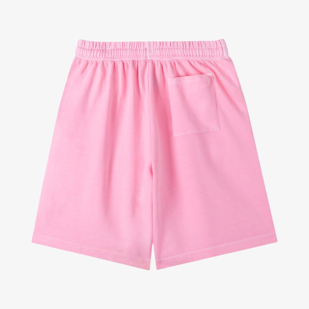 Belvarri vintage wash cotton shorts in light pink with a loose fit, elastic drawstring waist, and back pocket.