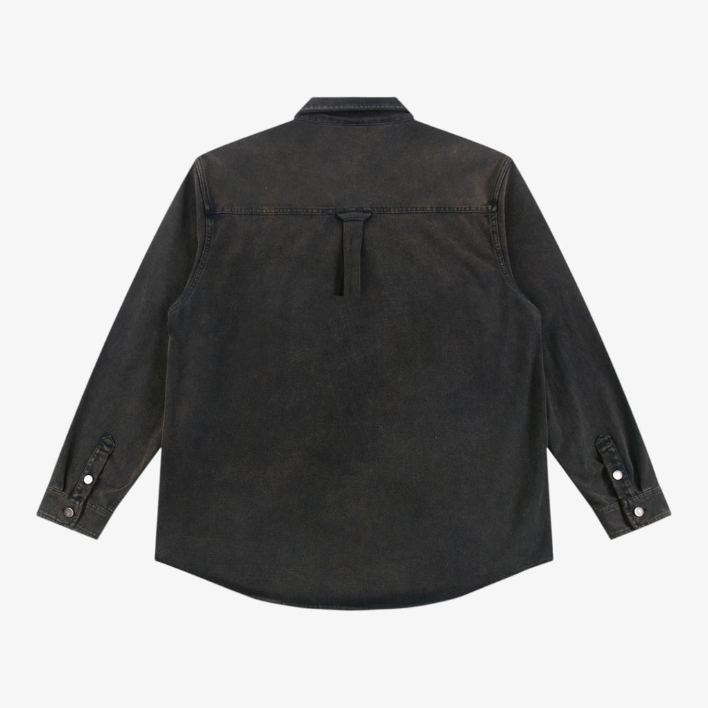 Back view of Belvarri vintage washed black heavyweight cotton denim jacket with button cuffs and yoke detail